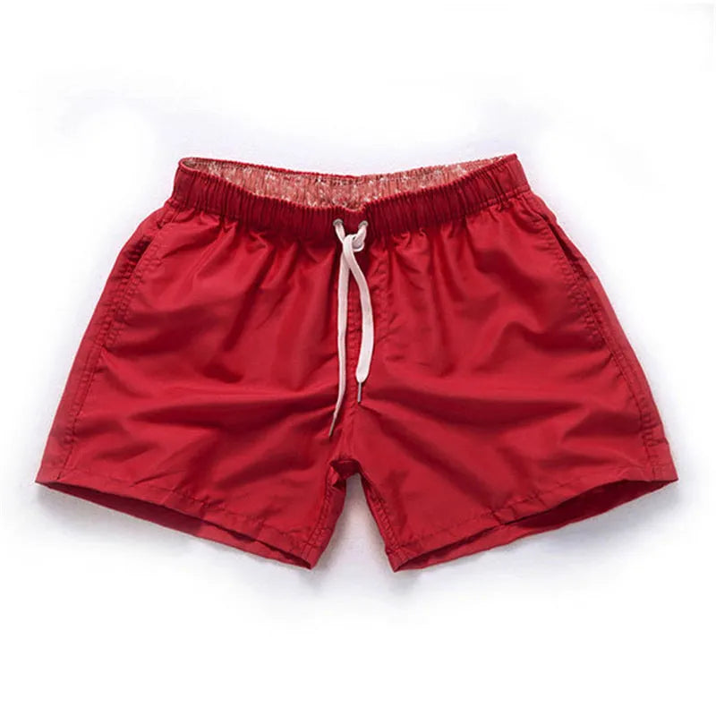Men's straight-leg beach shorts in polyester fabric, shown in multiple colour options.