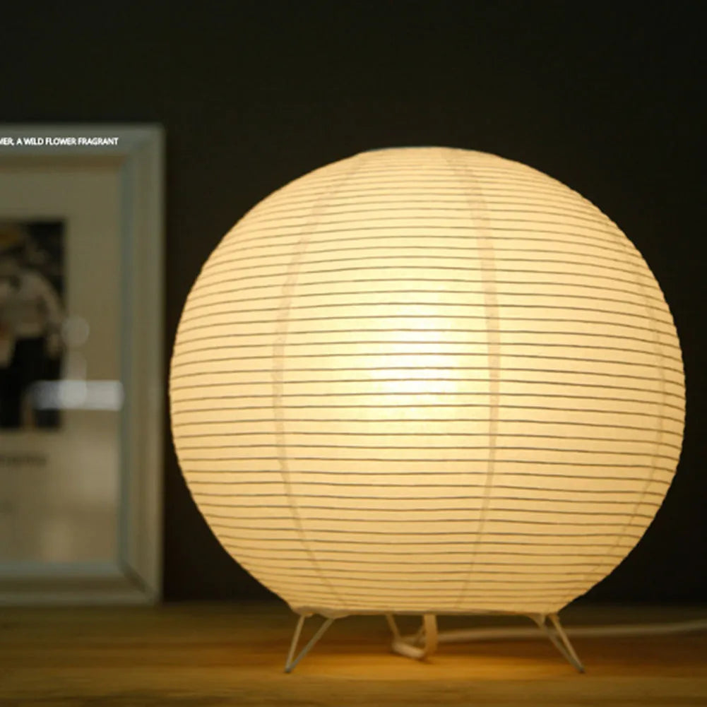Traditional handmade rice paper table lamp with E14 bulb fitting on bedside table