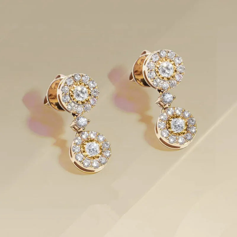 Women's gold copper round zircon stud earrings on a light background
