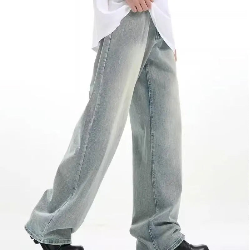 Blue retro-style loose casual trousers with an elastic waistband on a hanger.