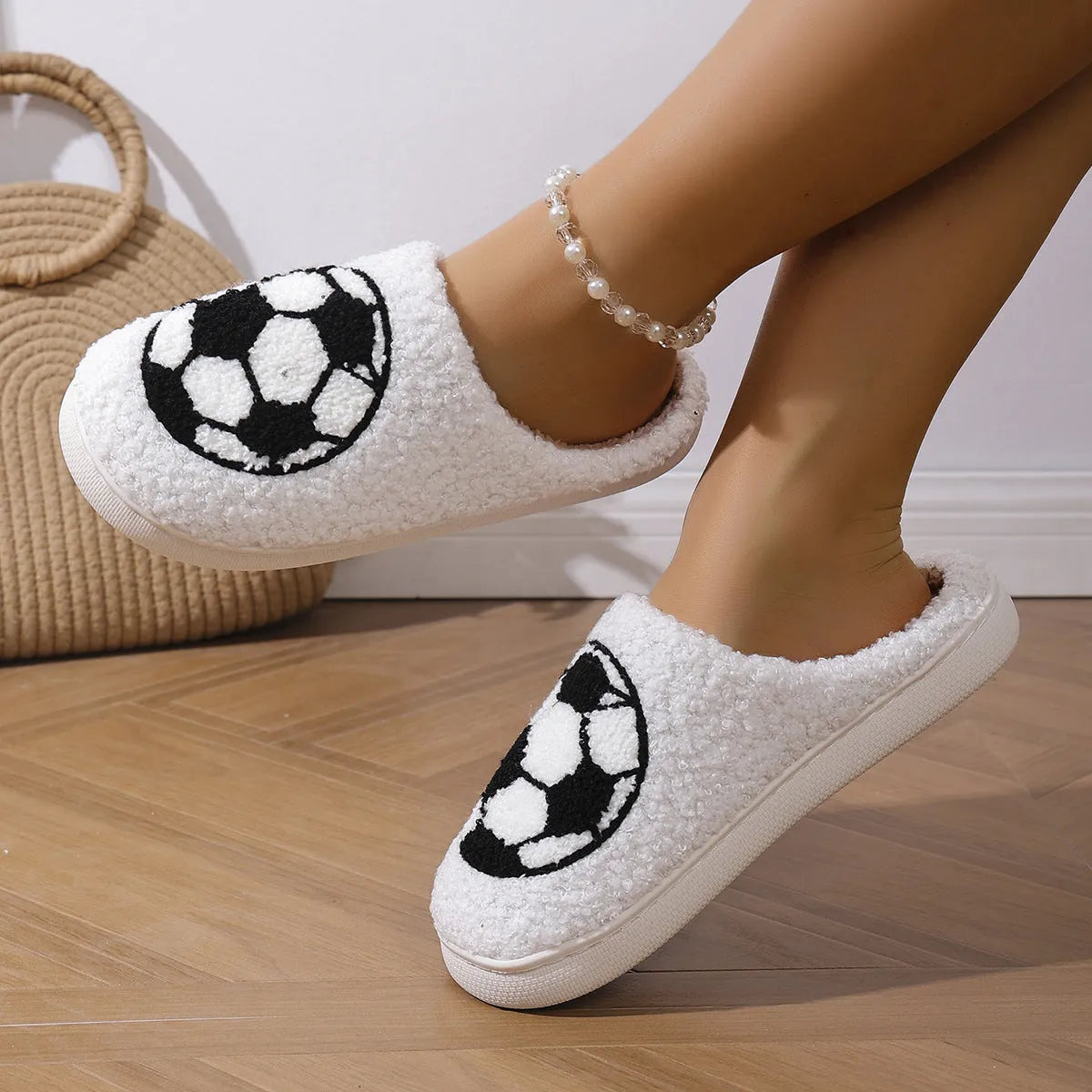 White thermal cotton slippers with ethnic totem pattern, plush upper, and TPR sole on a floor