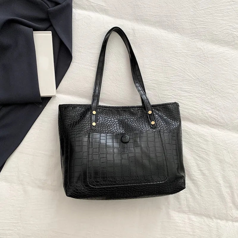 Retro large capacity single-shoulder handbag in brown, soft PU material with stitching detail, horizontal square shape.