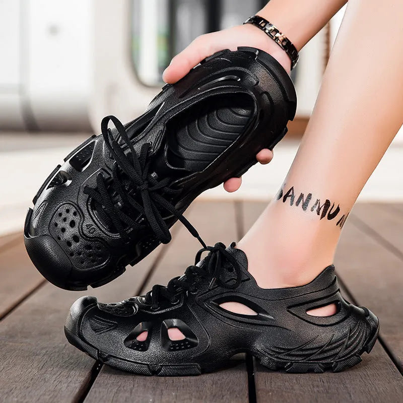 Men's black lace-up outdoor sports sandals with round toe and EVA sole on a rocky path.