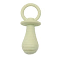 Four TPR rubber pet pacifier chew toys with squeakers in blue, grey, green, and pink colours