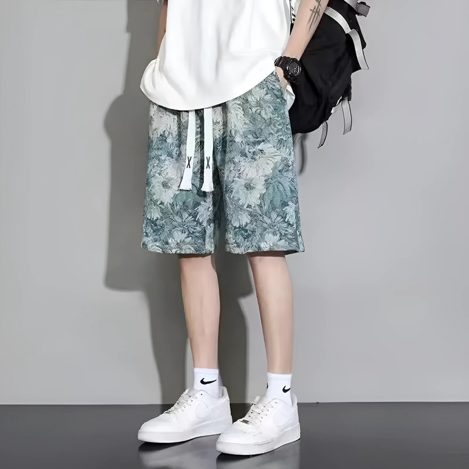 Men's summer fashion shorts in polyester with fifth pants length, showing bear print design.