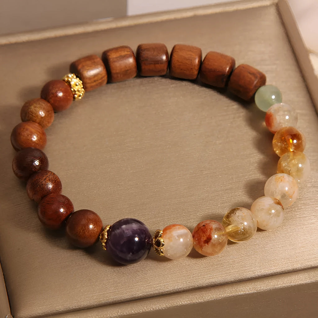 Women's bracelet in yellow tower crystal and amethyst tones with pearl and rhinestone decorative elements