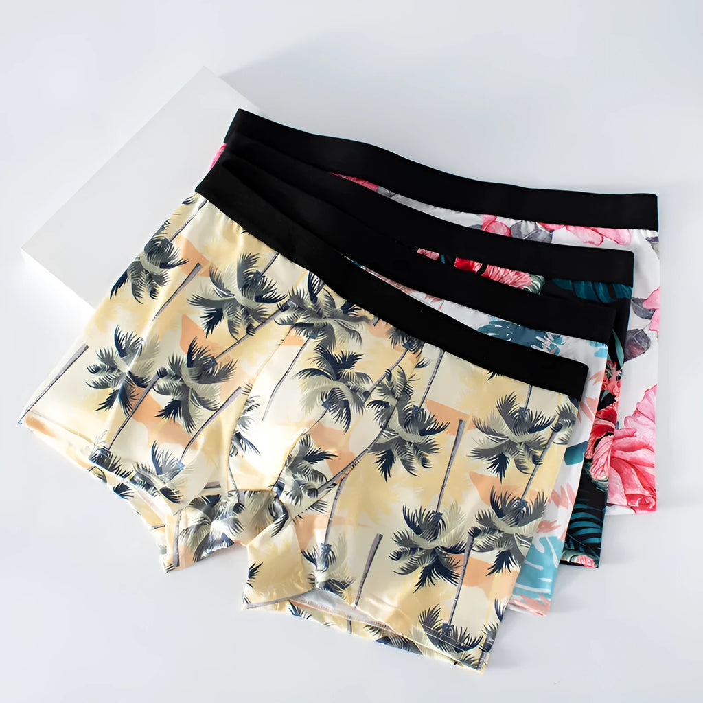 Men's printed ice silk boxer shorts showing floral pattern on breathable polyester fabric with mid waist design.