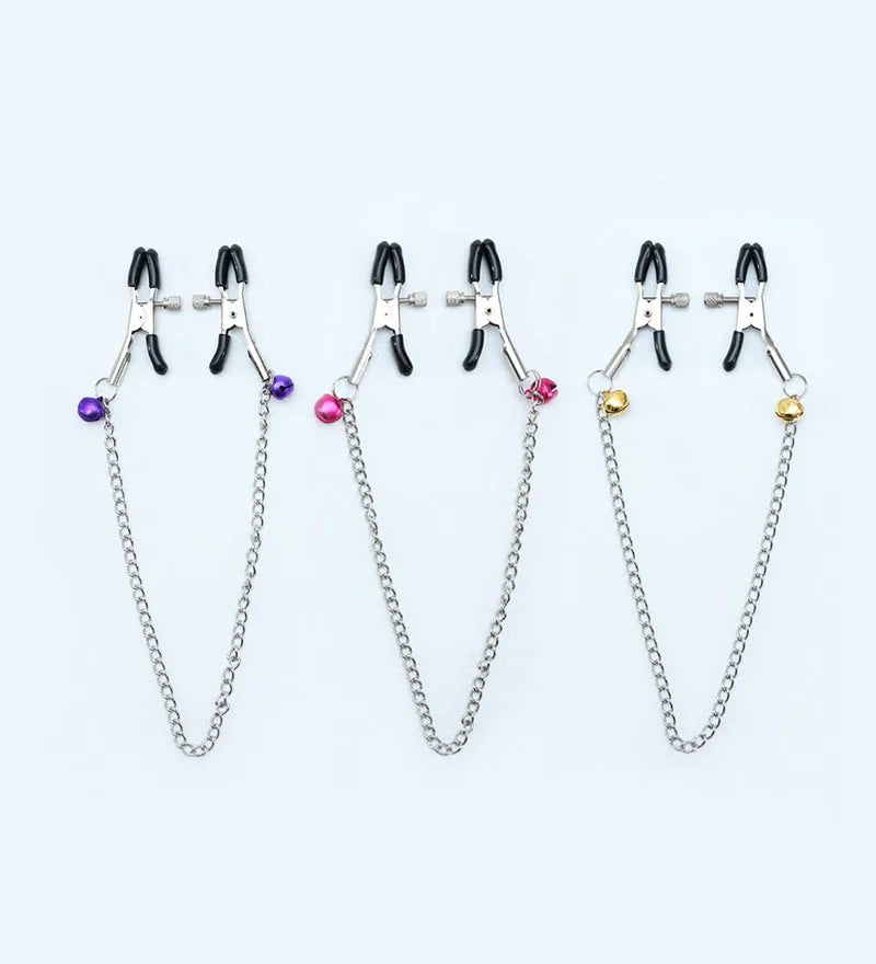 Red single bell nipple clamp pair with reel chain and two gold bells on white background