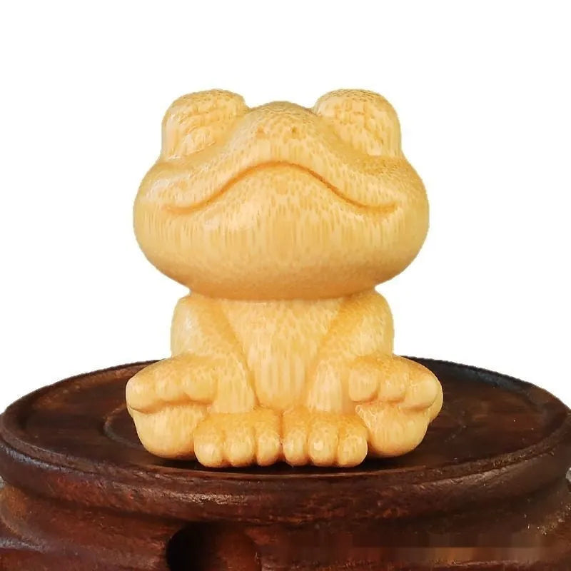 Solid bamboo carved smiling frog ornament with cartoon cute style, measuring 5cm high.