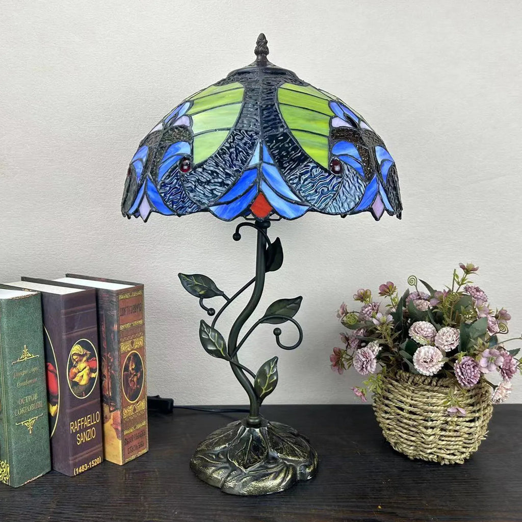 American Pastoral Tiffany 12-inch table lamp with coloured glass shade and resin base, 30 cm wide