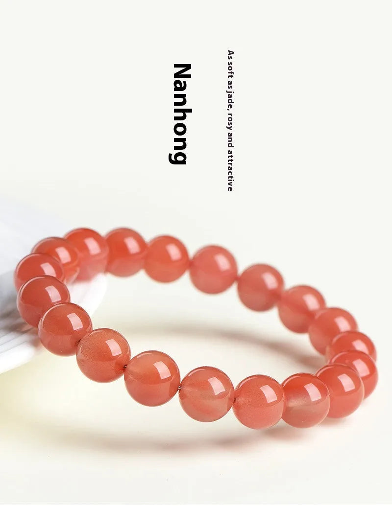 Natural South Red Cherry Agate scattered bead bracelet showing polished gemstone beads on a wrist.