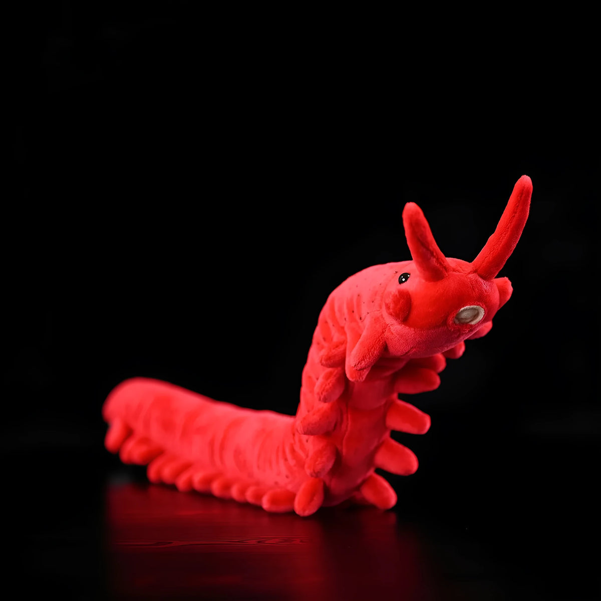 Red velvet worm plush toy silkworm doll 60cm long soft stuffed animal on a plain background