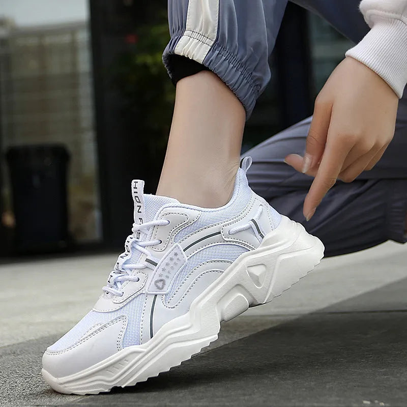 White women's casual sports shoes with mesh upper, buckle closure, and thick PU sole