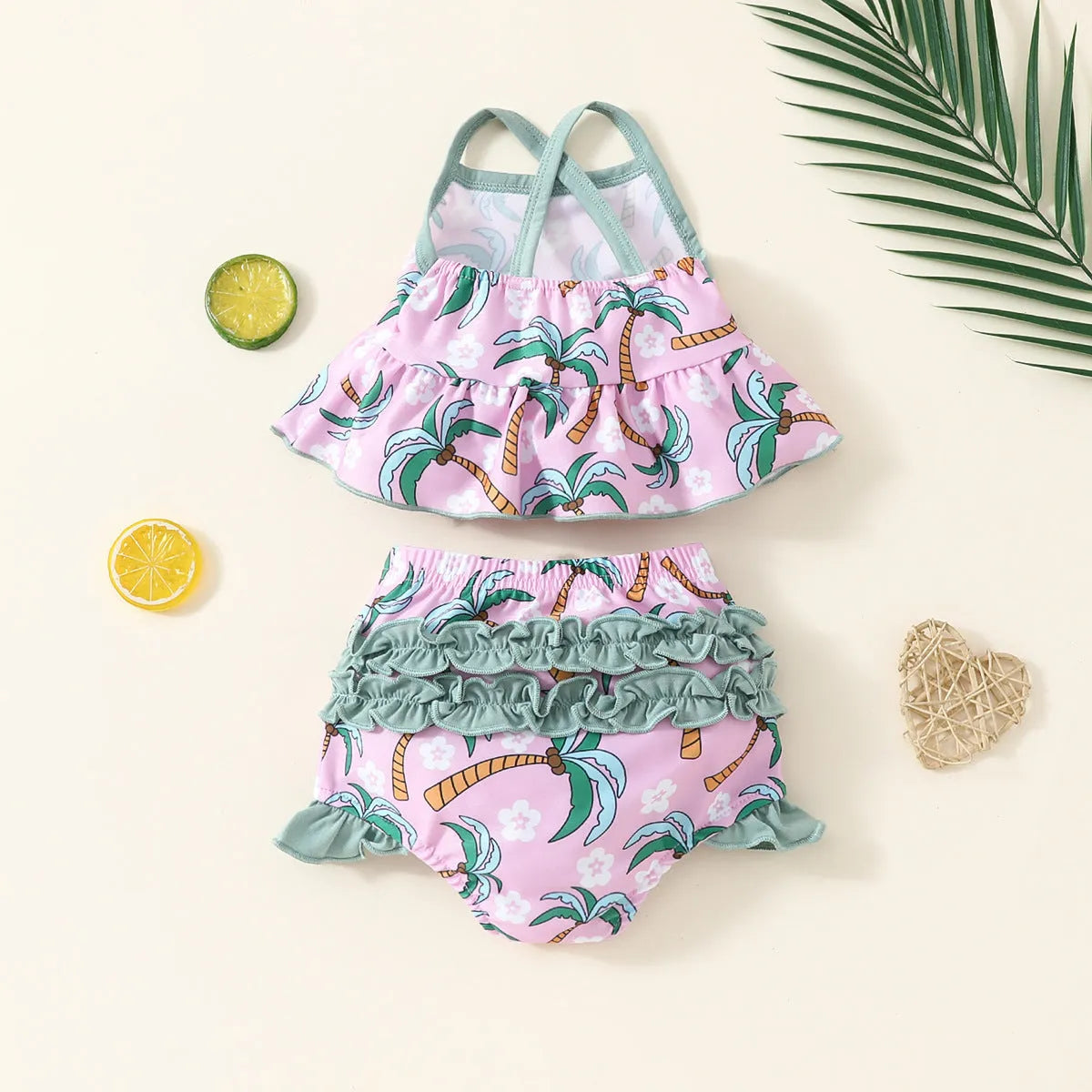 White children's two-piece swimsuit set with shirt and shorts, suitable for ages 6 months to 3 years.
