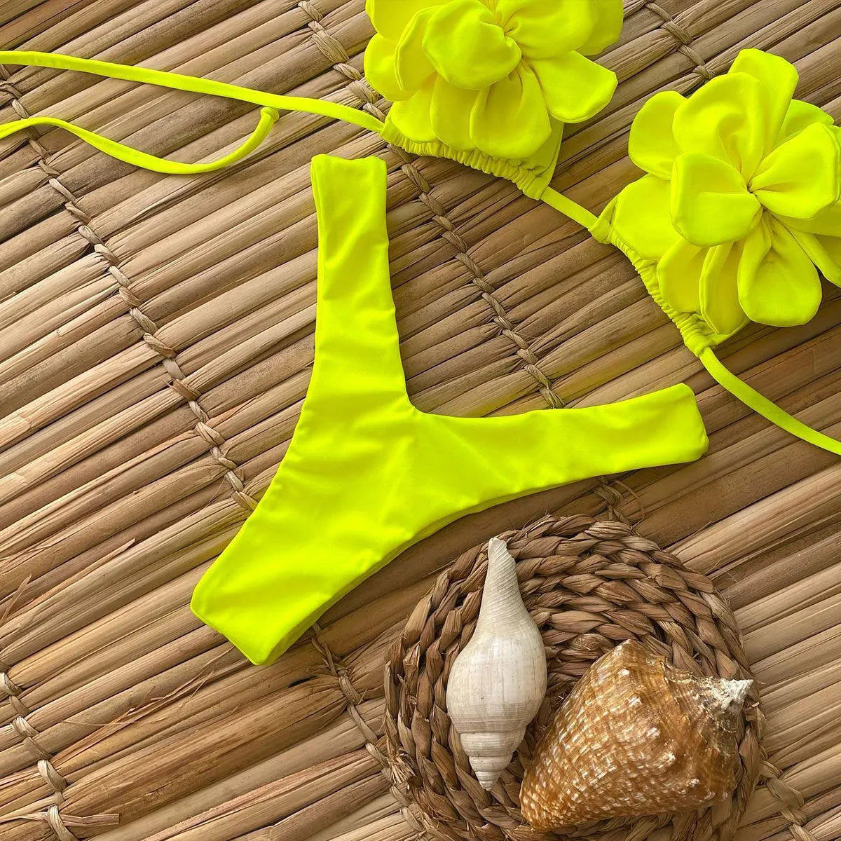 Three-dimensional 3D flower pattern on low waist bikini swimsuit in solid colour