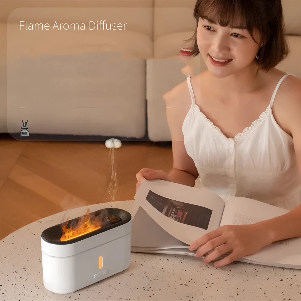 White resin flame lamp humidifier with two fog outlets and visible flame effect on a wooden table