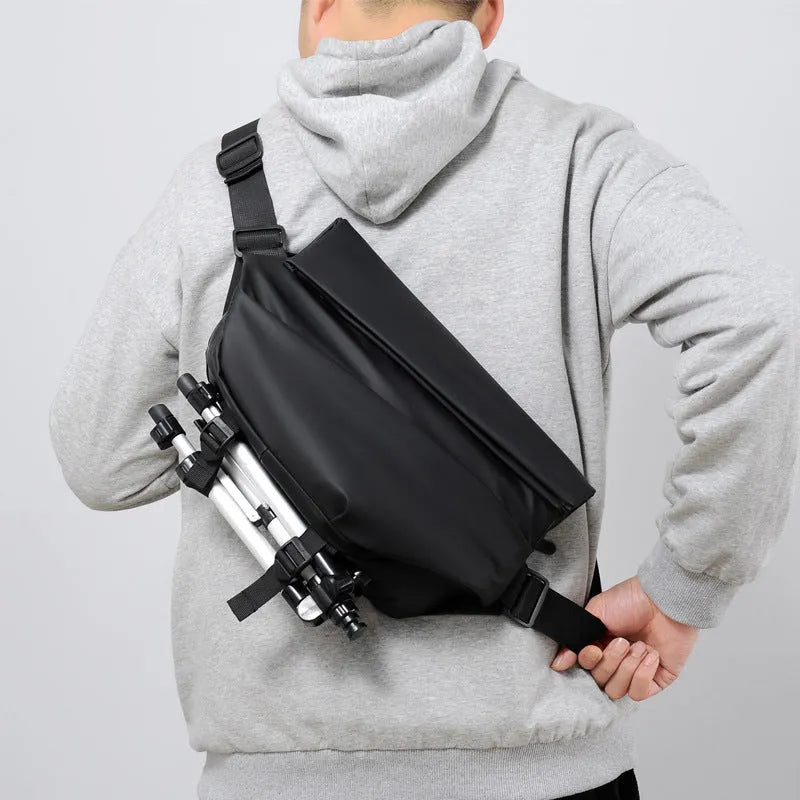 Grey PU leather crossbody bag for men showing front zipper and adjustable shoulder strap
