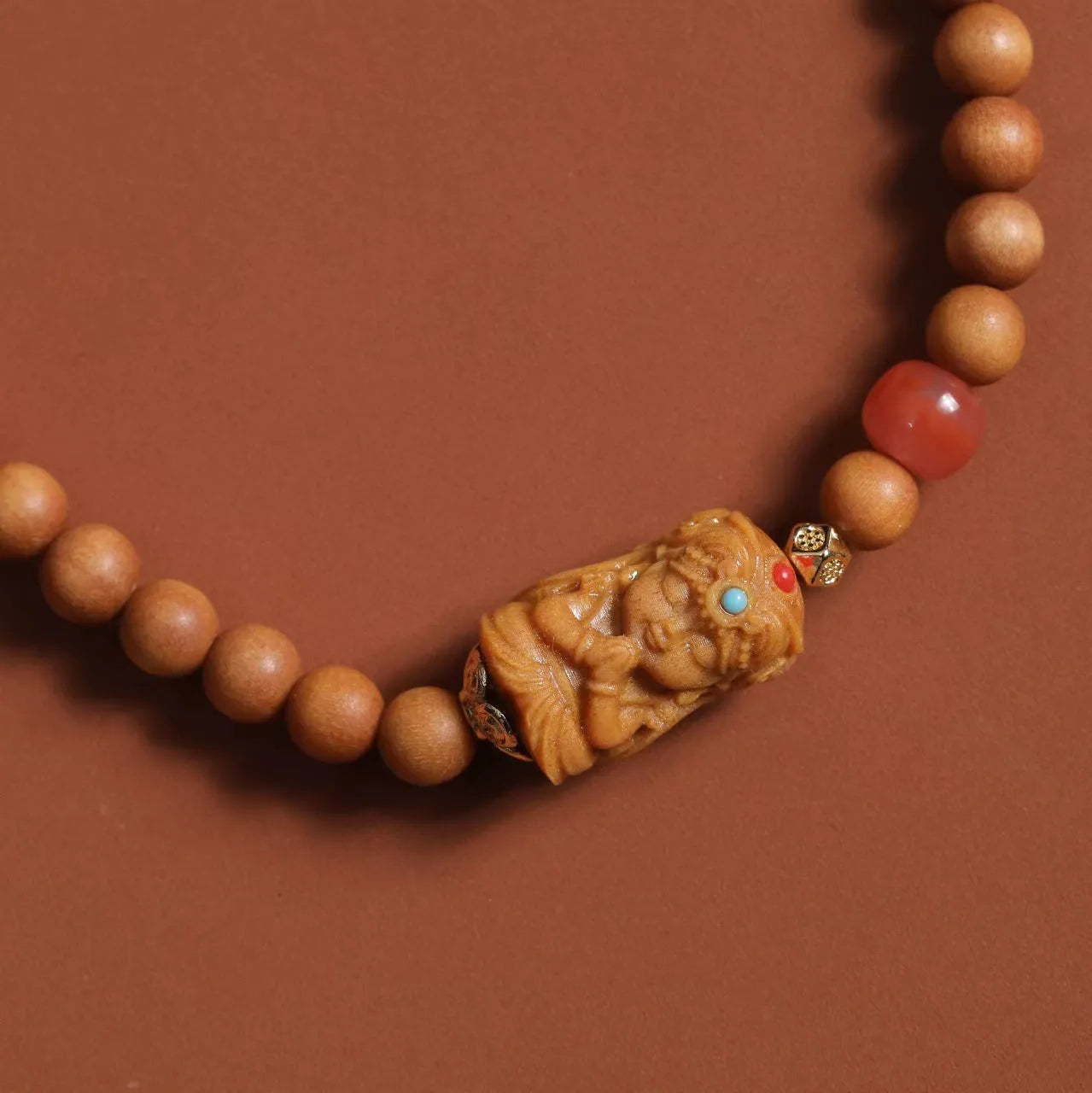 Brown wooden double circle bracelet with woven Zachilam pattern and 6mm round beads