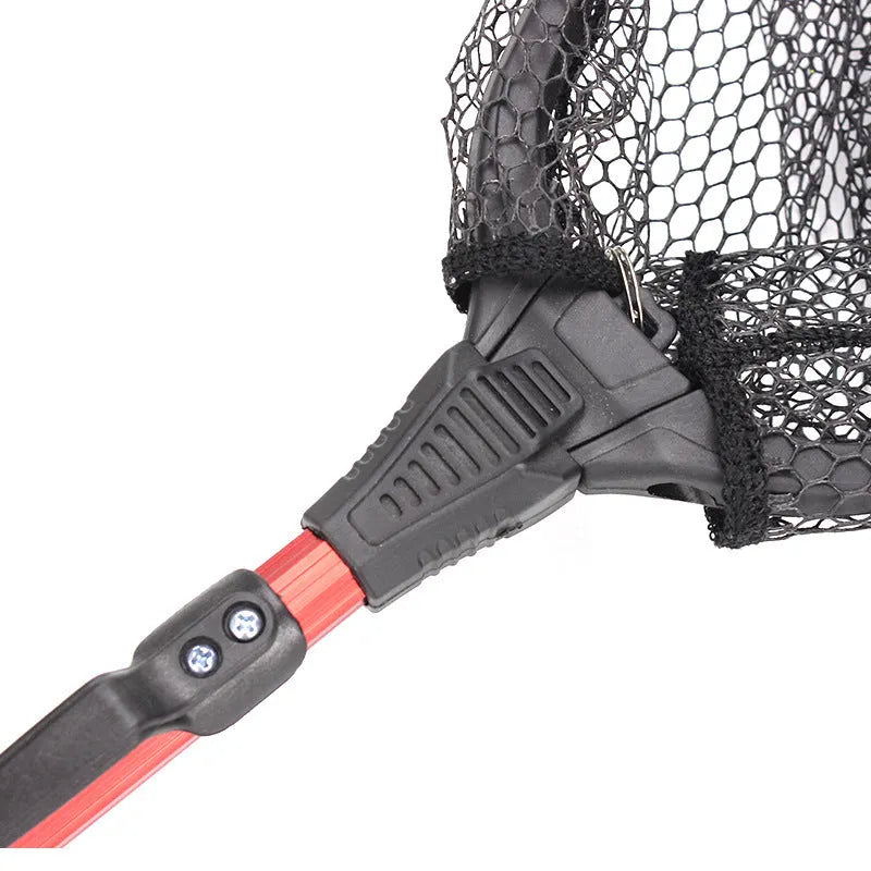 Red aluminium alloy single section triangular folding dip net collapsed to 47cm length, with viscose mesh, on a wooden table