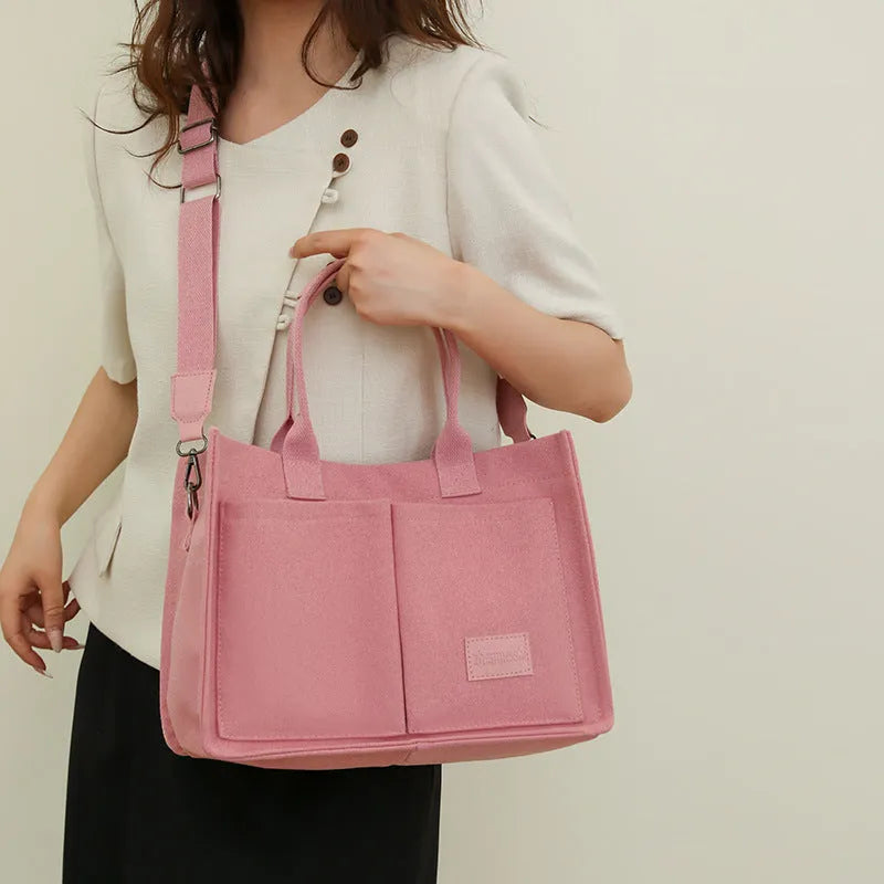 Large capacity canvas tote bag for women with multiple pockets and crossbody strap in creamy white