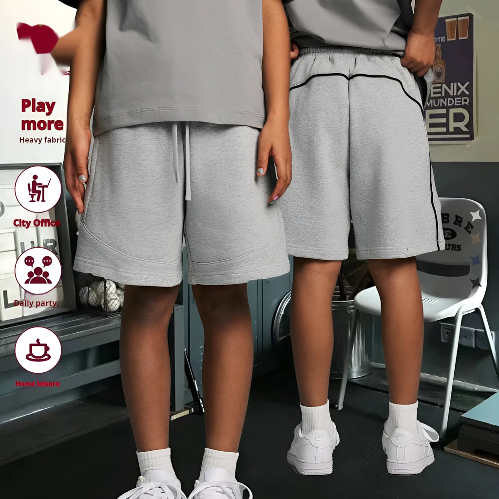 Solid colour cotton children's sports shorts in loose fit design available in multiple sizes