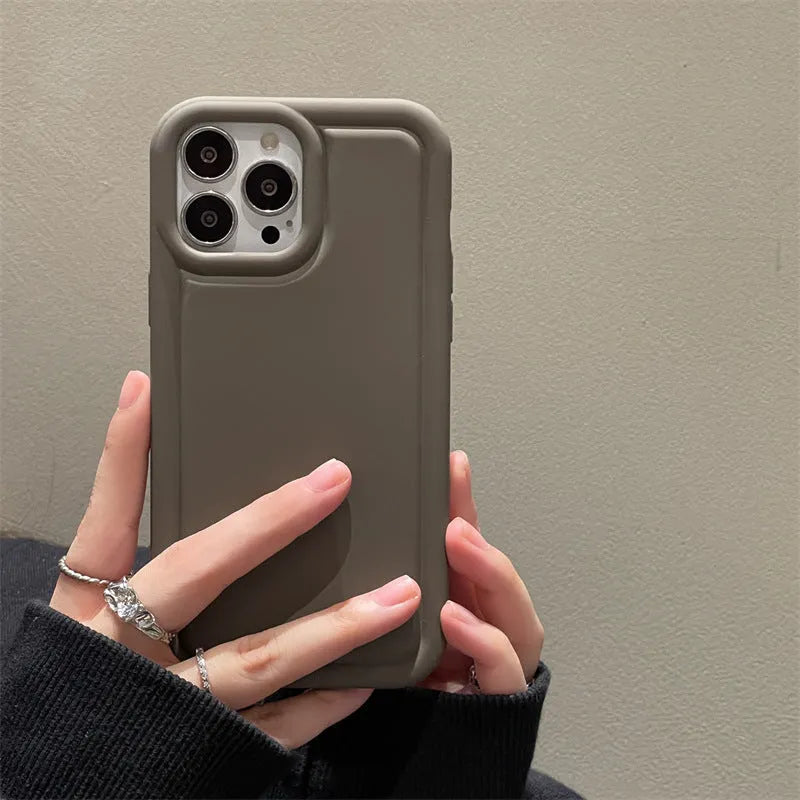 Silicone soft phone case for iPhone in black, showing rear cutout for camera and side buttons