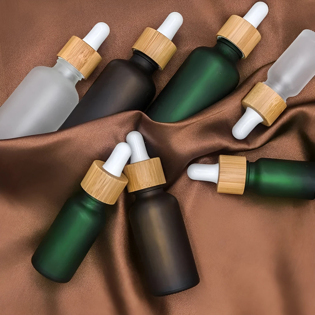 Glass fine oil bottle with glue head dropper and lid, 5ml to 100ml, amber UV-protecting for essential oils and cosmetics.