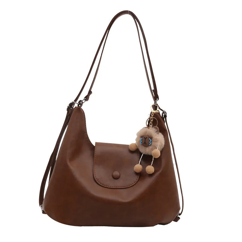 Large capacity PU leather single shoulder bag in black with internal mobile phone pocket