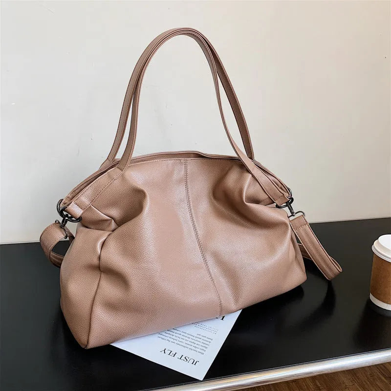 Large soft surface PU messenger tote bag in black with adjustable shoulder strap and zipper opening.