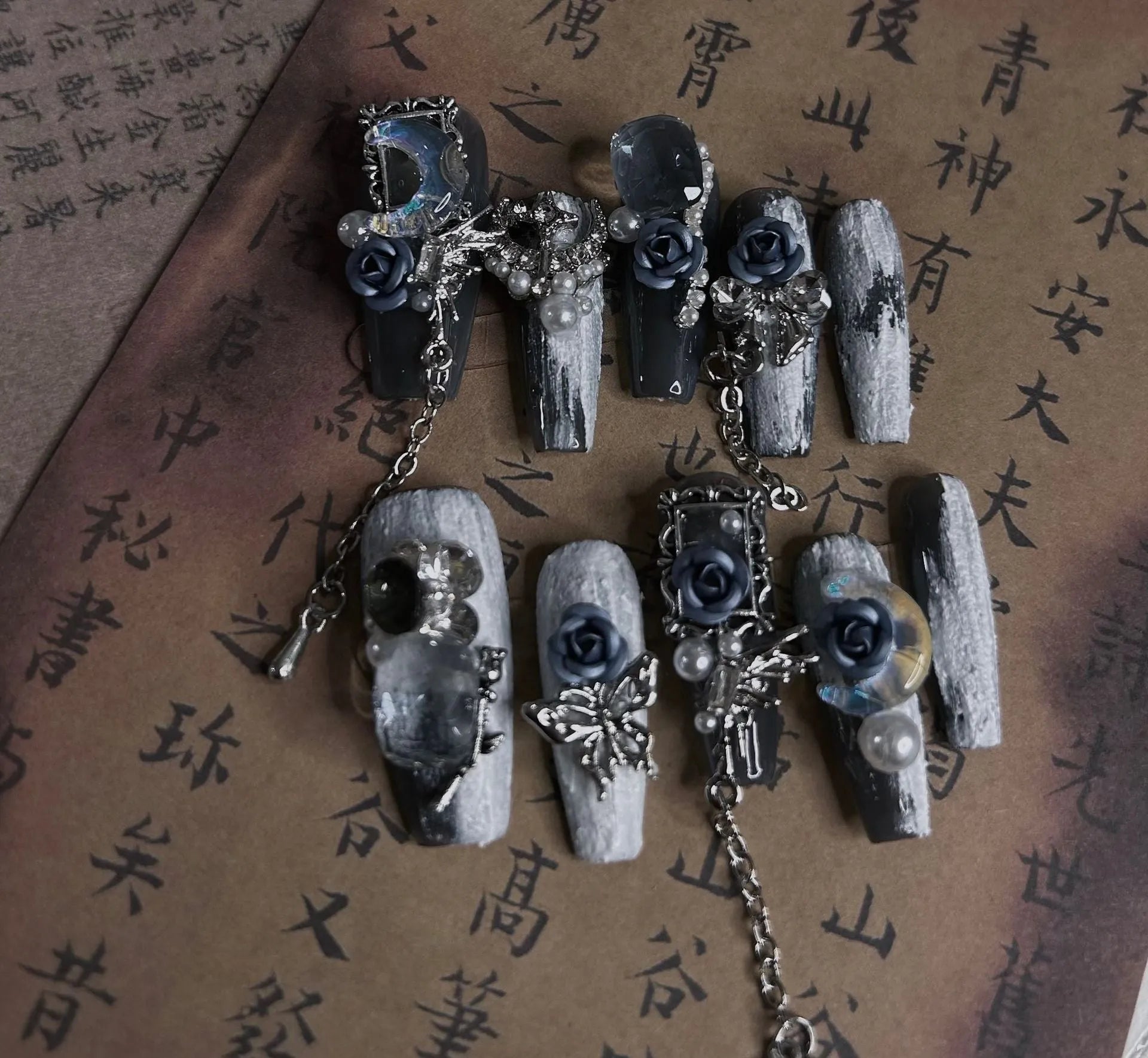 Heavy industry blue night manicure set with rose and tulip floral designs on plastic armour suit.