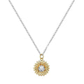 Silver sunflower necklace with geometric pendant and cross chain on a model.