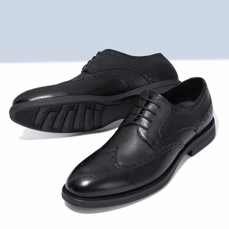 Men's classic brown brogue leather business shoes on a white background.