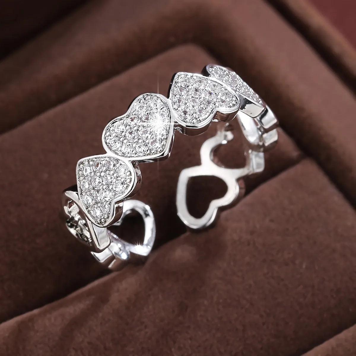 Geometric adjustable couples ring with a love heart design in gold or silver finish.