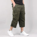 Man modelling loose-fitting khaki cotton cropped casual pants.