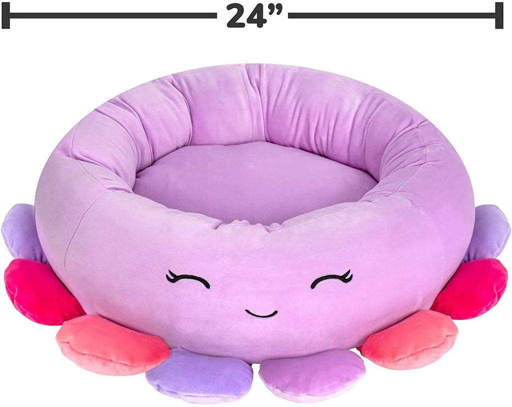 Large Squishmallows plush pet bed in green with bolster edges and non-skid bottom on floor