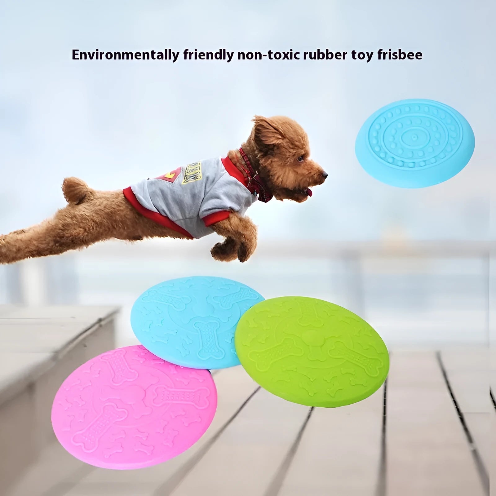 Plastic dog flying disc toy in green, shown on grass for scale