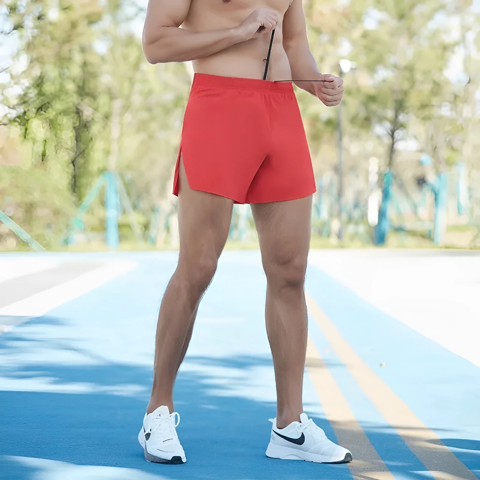 Man wearing high-waisted grey off-road running shorts for cross-country running.