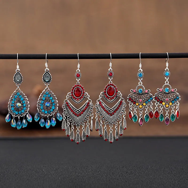 Retro long drop earrings with purple crystal fringes on an alloy setting.