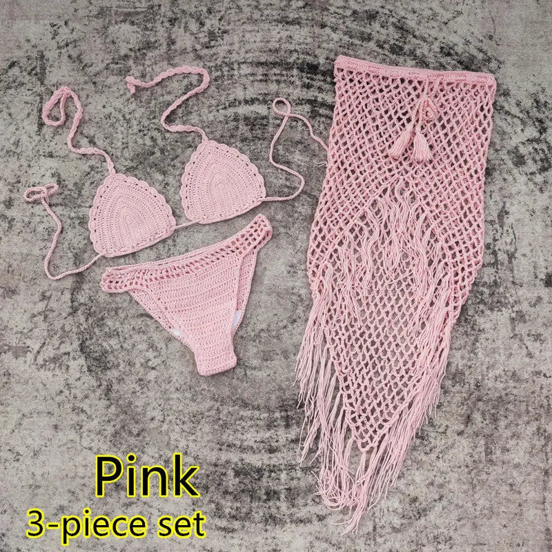 Women's white handmade crochet bikini swimsuit set with a separate matching skirt.