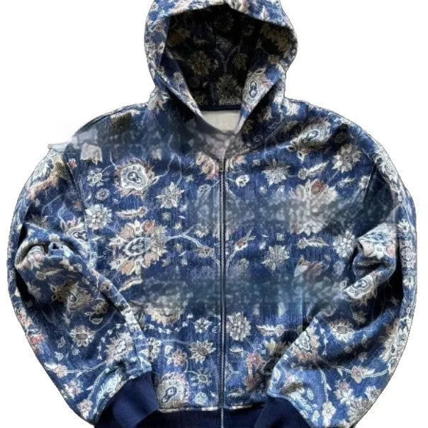Man wearing a loose-fitting blue hooded zip-up coat with digital printing.