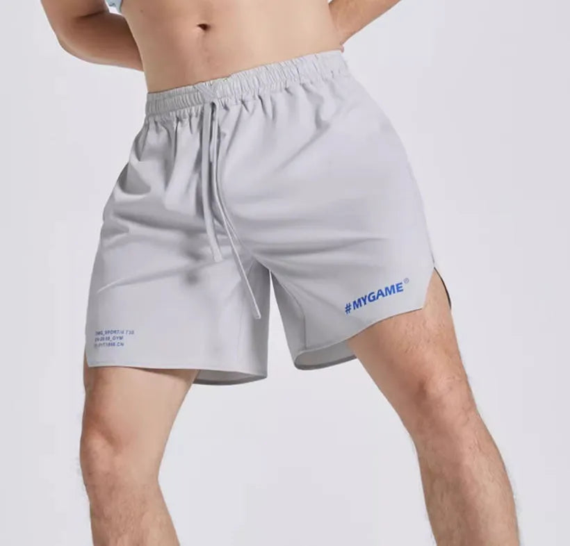 Men's navy blue training shorts with moisture-wicking fabric on a grey background.