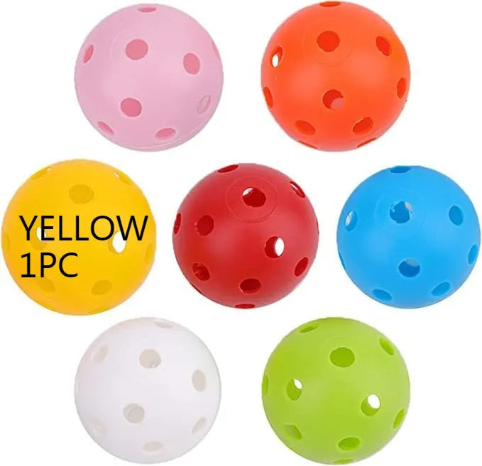 Assorted multi-colour 42mm golf practice balls with a net bag, shown next to practice putting holes.