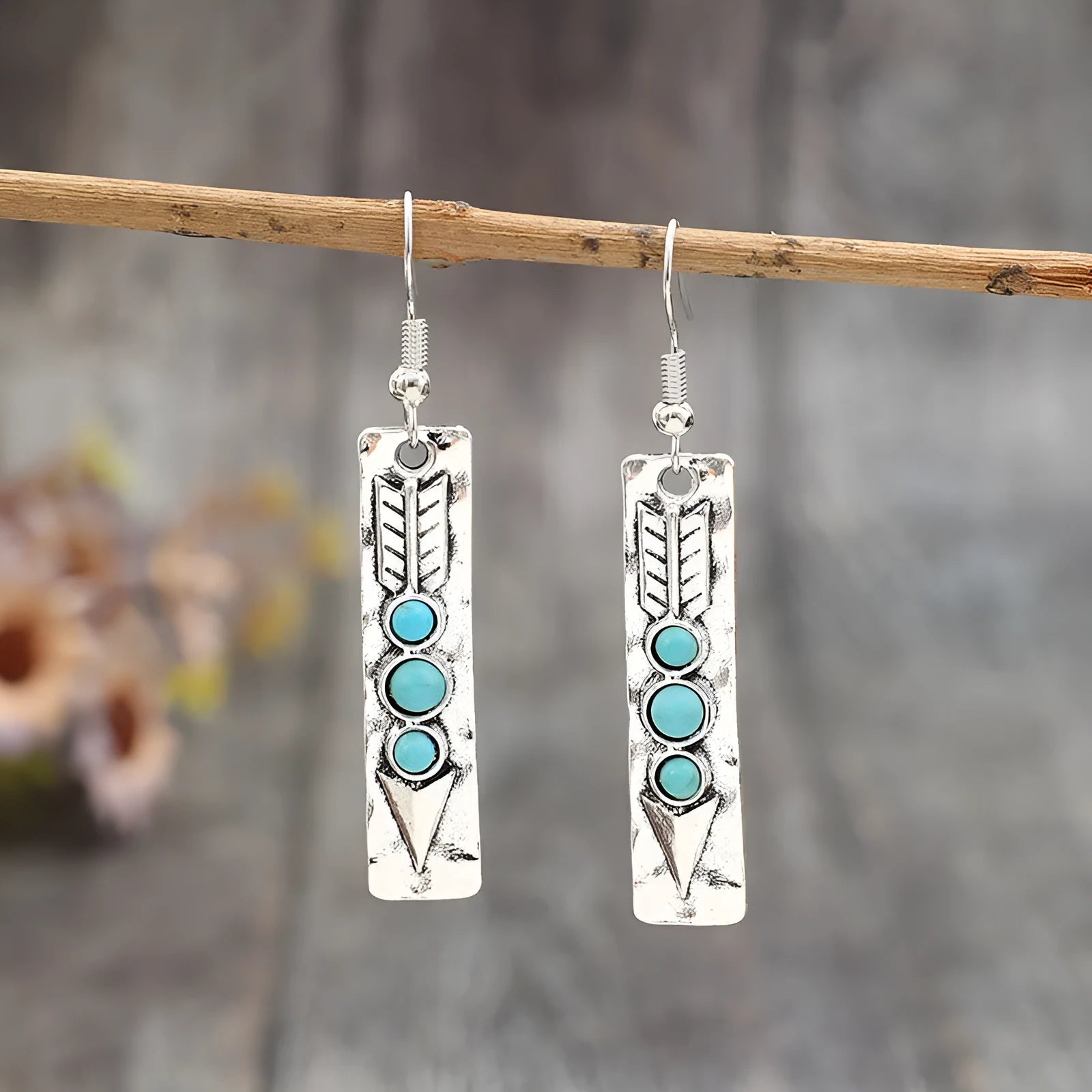 Silver geometric drop earrings with turquoise inlay detailing on long strip design