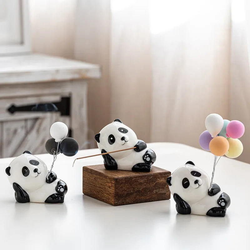 Ceramic panda incense burner with closed eyes on a desk, 8.5cm tall, for office aromatherapy