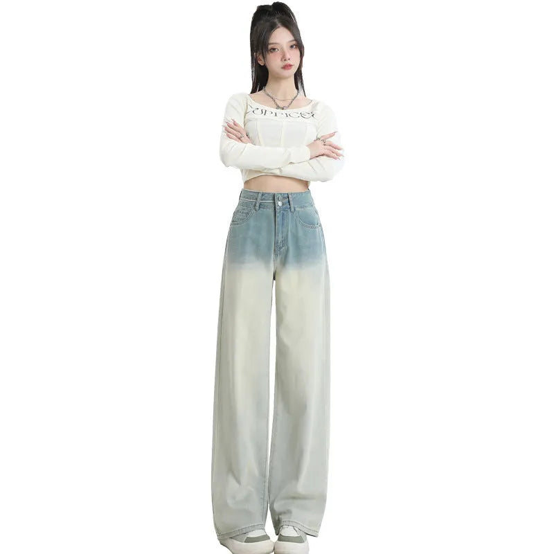 Women's gradient blue straight-leg wide-leg denim trousers laid flat.
