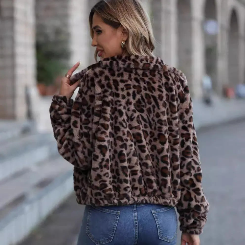 Women's loose fit leopard print plush coat with front zip and raglan sleeves.