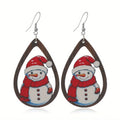 Women's wooden Christmas earrings with printed tree and snowman designs on geometric shapes