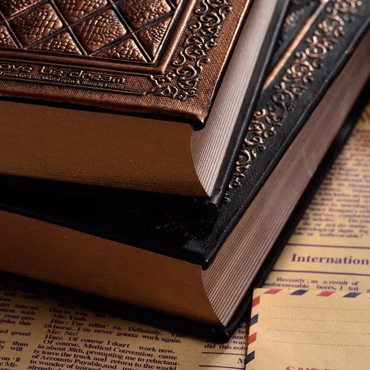 Embossed faux leather notebook with a thick notepad, shown in bronze and black gold colour options.