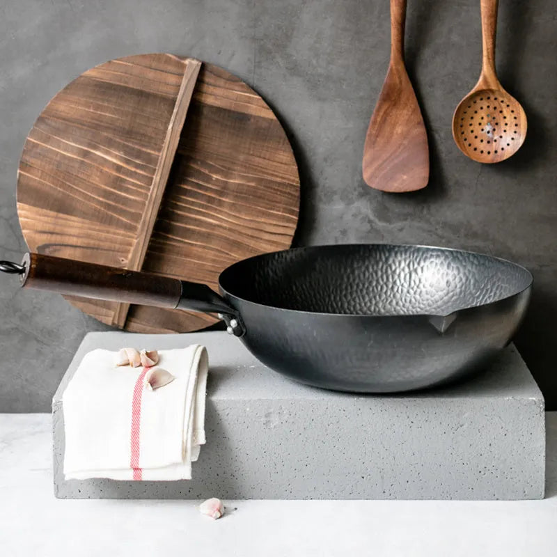Traditional black iron wok with wooden handle measuring 40cm diameter