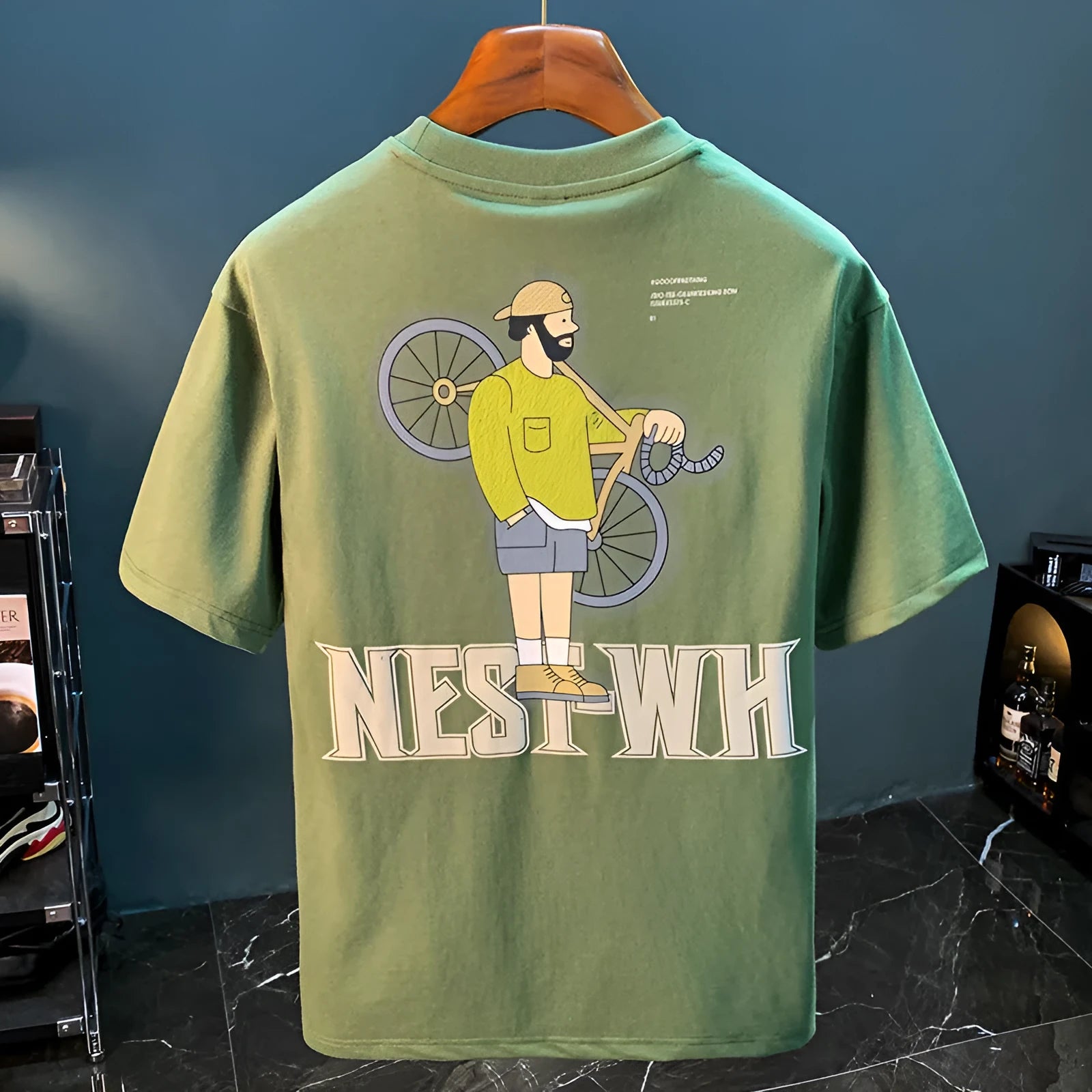 Green men's loose fit t-shirt with literary printed design on front, short sleeves